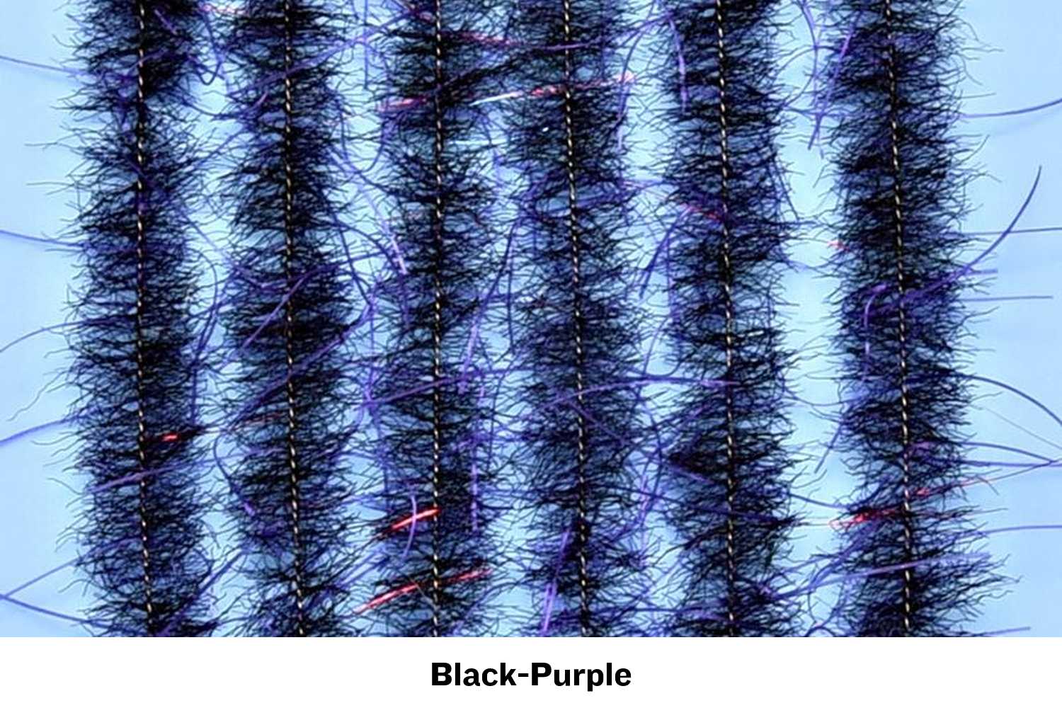 Black-purple Woolly Critter fly tying brush with dense fuzzy fibers, stitched core and purple/red flash