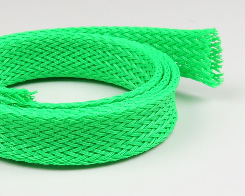 Neon green braided plastic body tubing coil with open mesh weave for fly tying