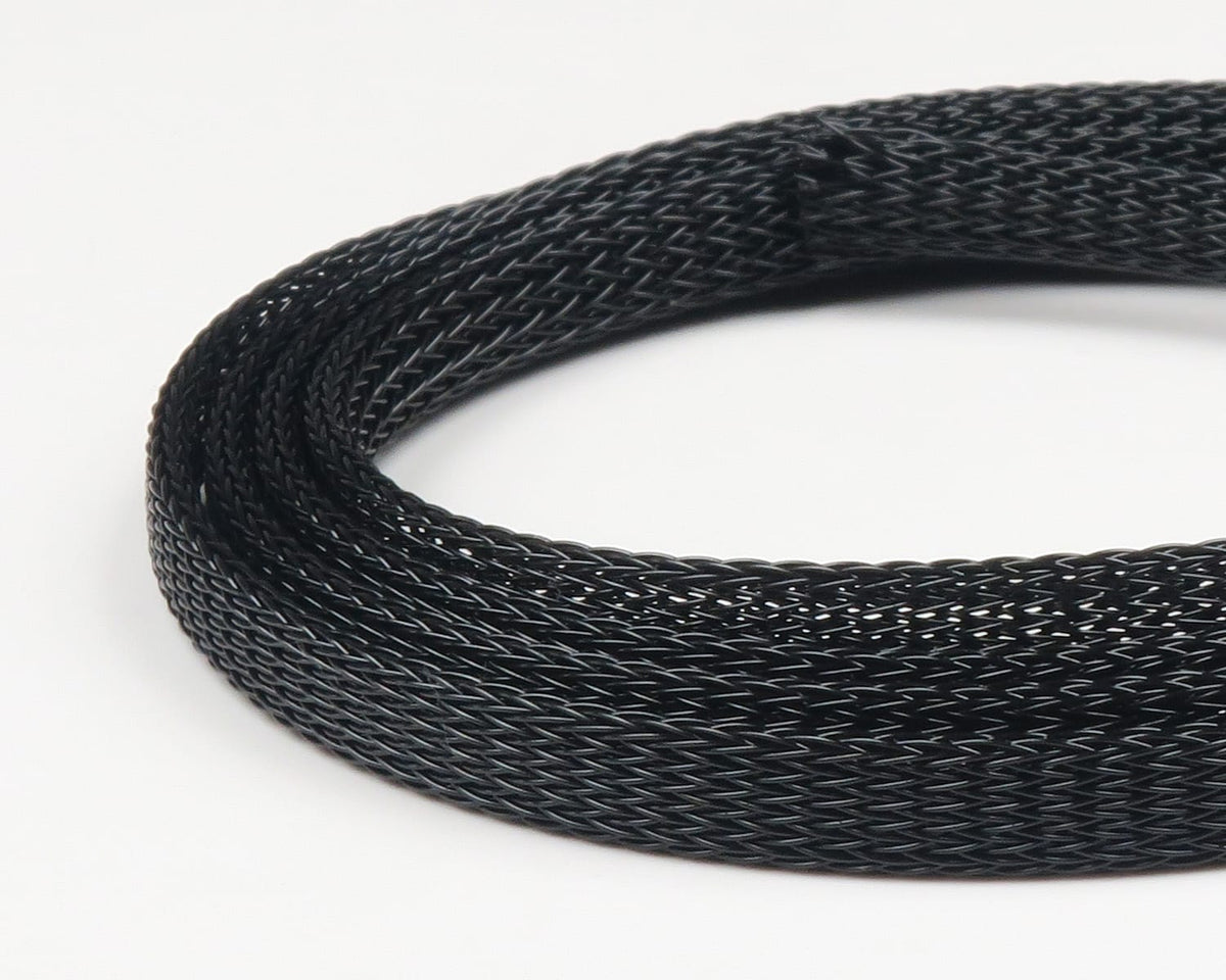 Black braided Fish-Skull body tubing coil with fine mesh texture for fly tying, synthetic tubular material