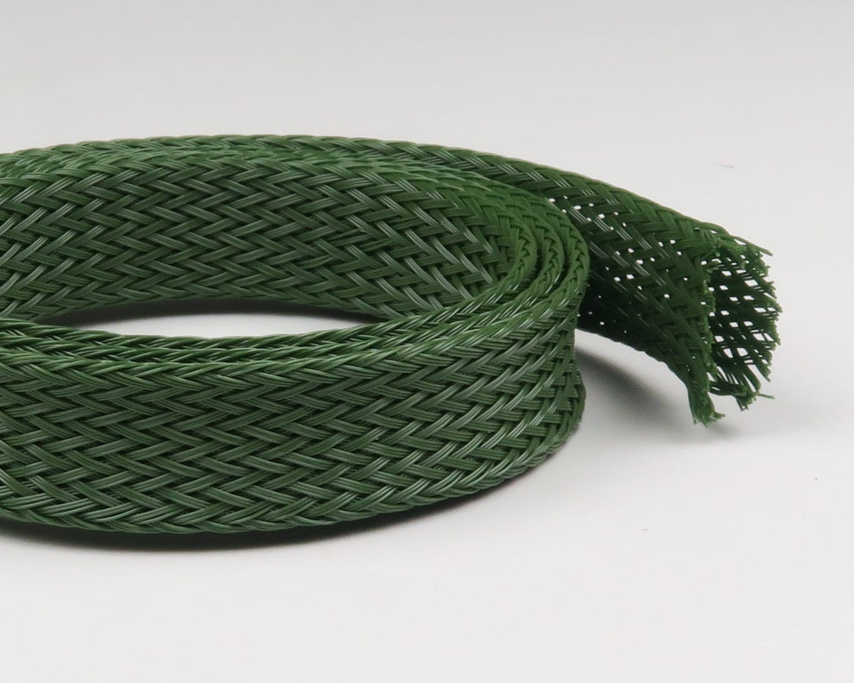 Coiled olive green braided synthetic body tubing with tight woven mesh and frayed end, flexible hollow sleeve for fly tying