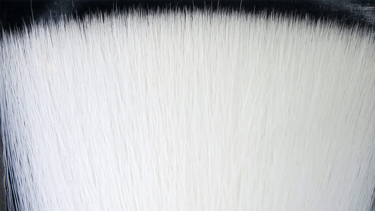 White Fish-Skull faux bucktail fibers, long silky synthetic strands with glossy black band at top for fly tying
