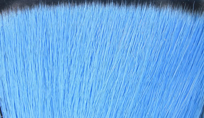 Bright sky-blue synthetic bucktail fibers for fly tying, dense faux hair strands with tapered tips (Fish-Skull)