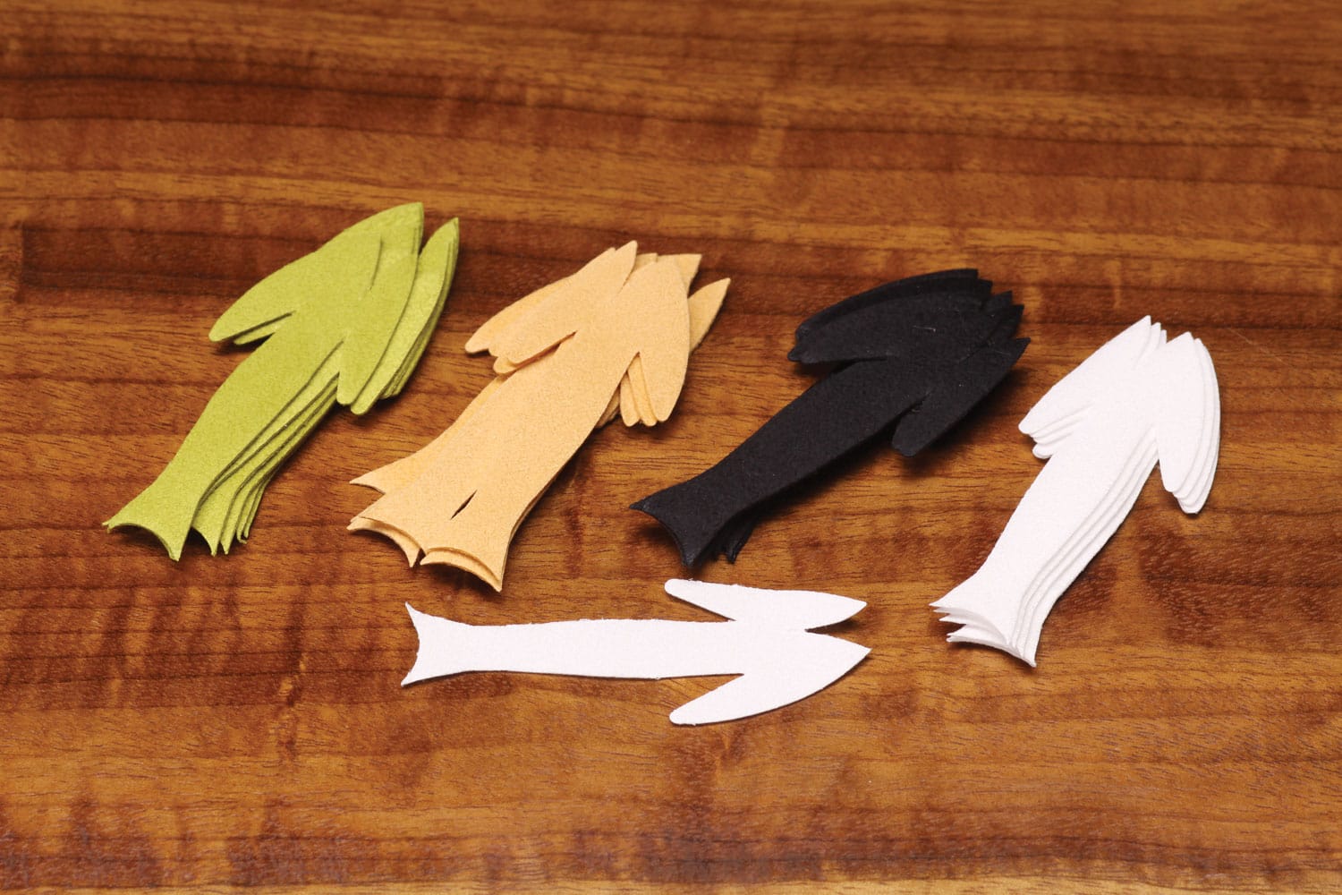 Stacked Fish-Skull Frantic foam tails in green, tan, black and white for fly tying