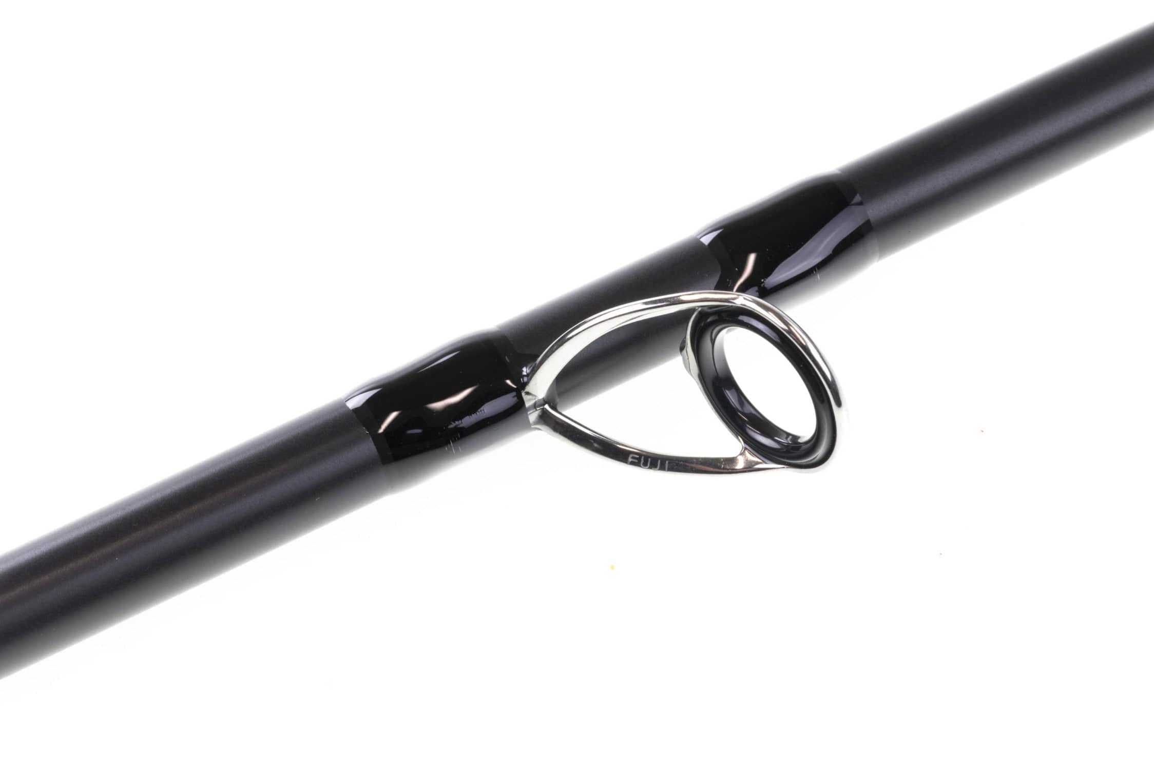 Matte black carbon fly rod blank with glossy wraps and polished Fuji silver guide ring, G. Loomis musky rod