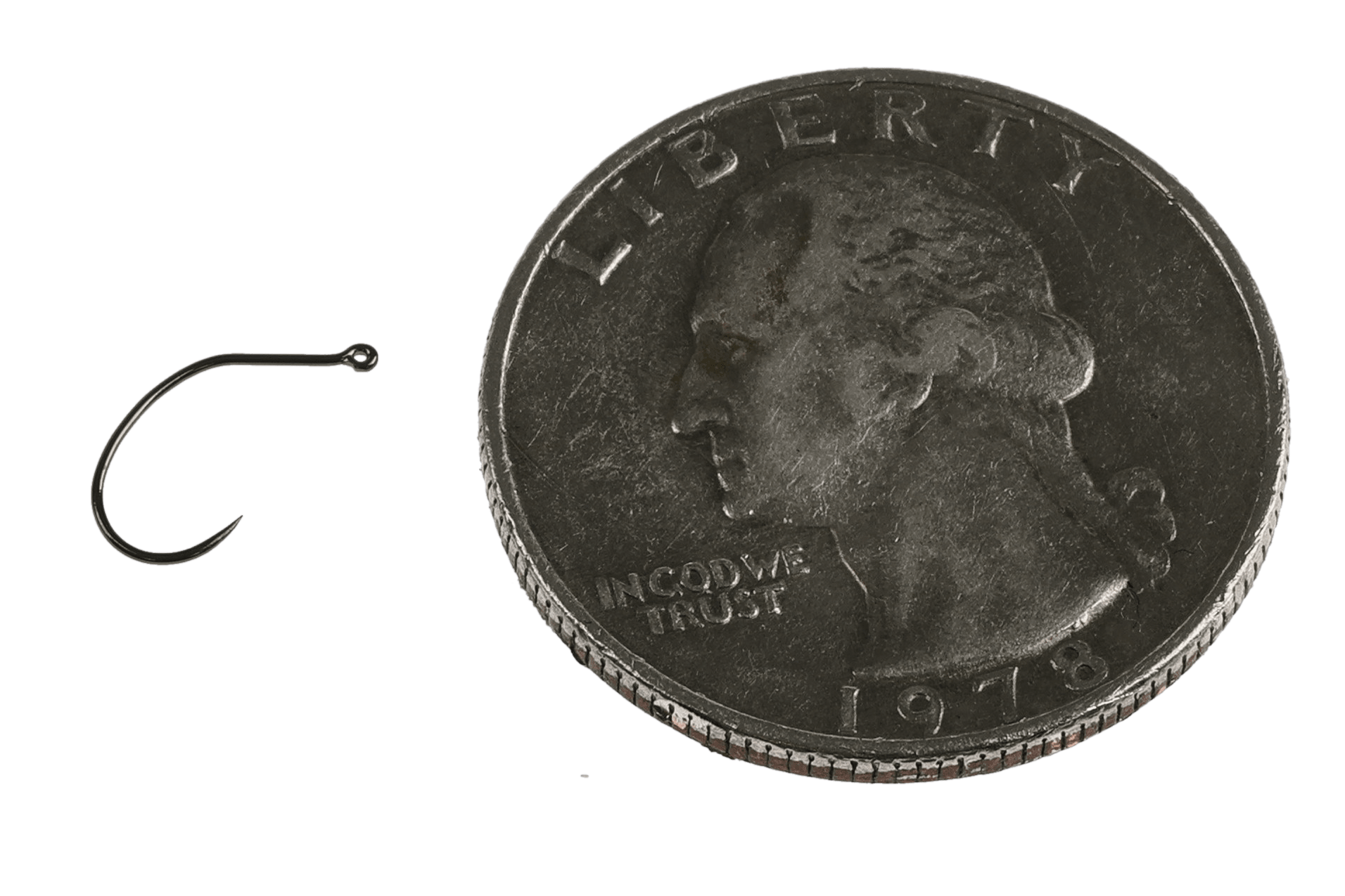 Black nickel vertical-eye emerger hook beside US dime for scale, small curved Gamakatsu fly tying hook