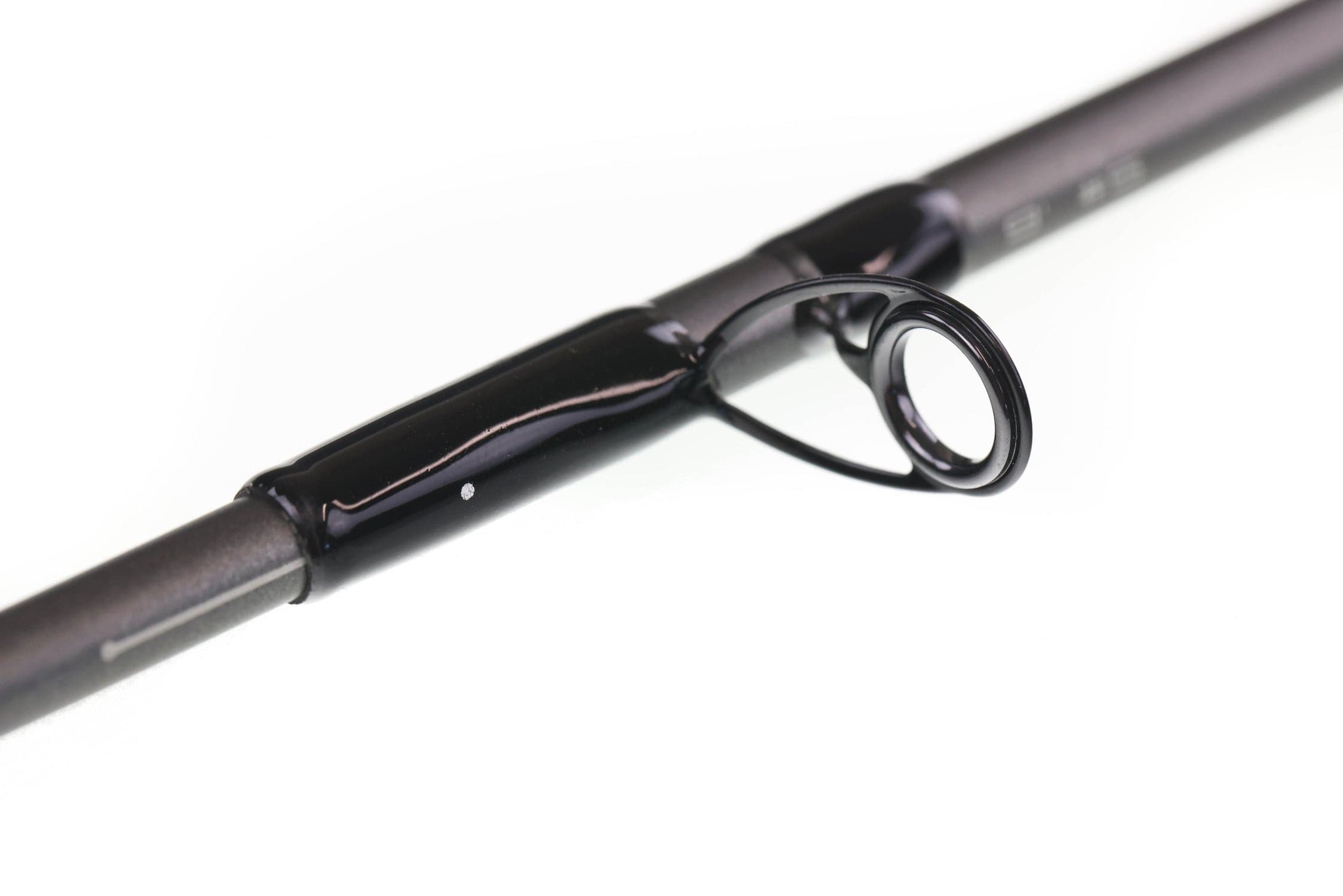 Greys black graphite kite fly rod close-up showing glossy black guide ring and matte dark blank