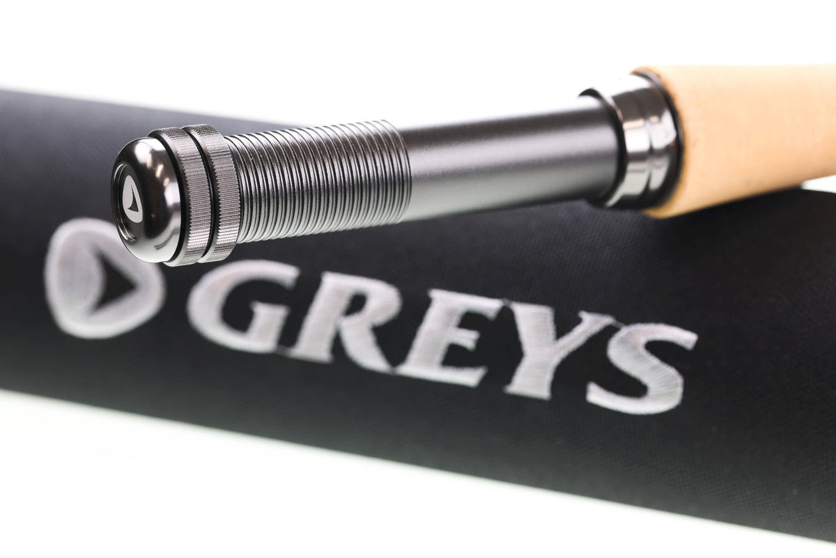 Greys Lance fly rod close-up: silver threaded metal reel seat, polished butt cap with logo and natural cork handle