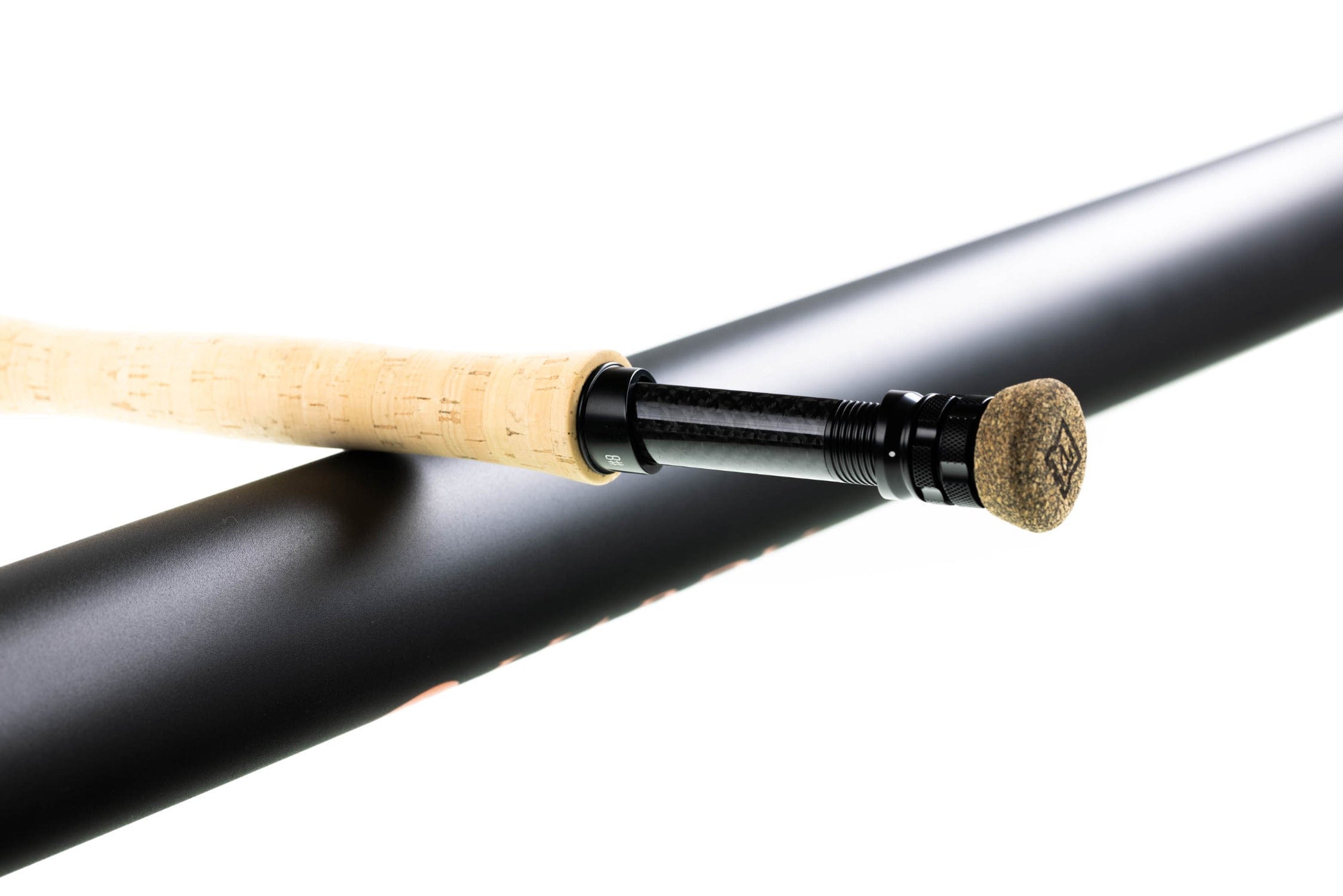 Hardy Ultralite X fly rod close-up: light cork grip, black carbon reel seat and matte black blank