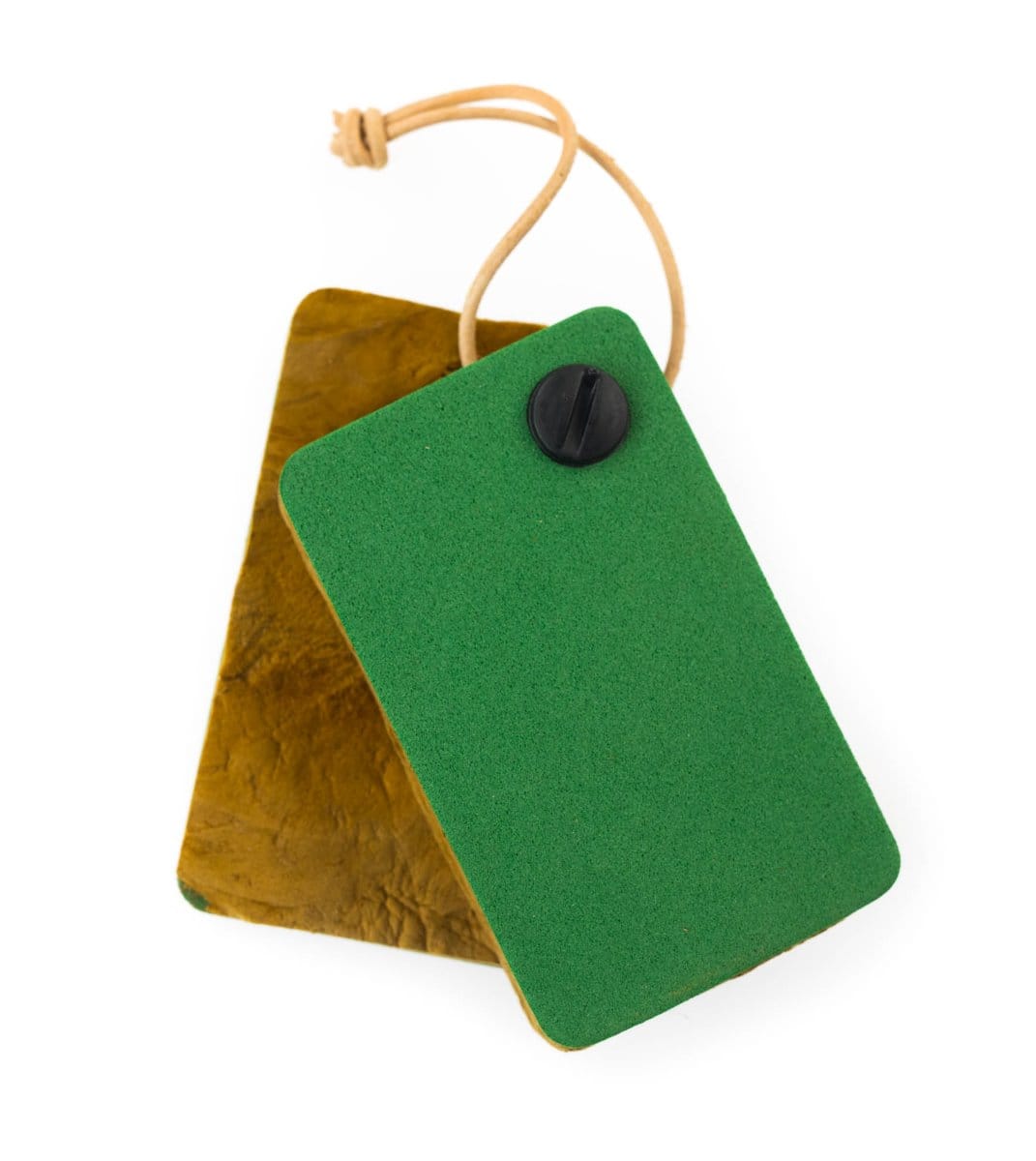 Green foam and tan amadou dryer pads with black screw and leather loop, rectangular fly-tying accessory
