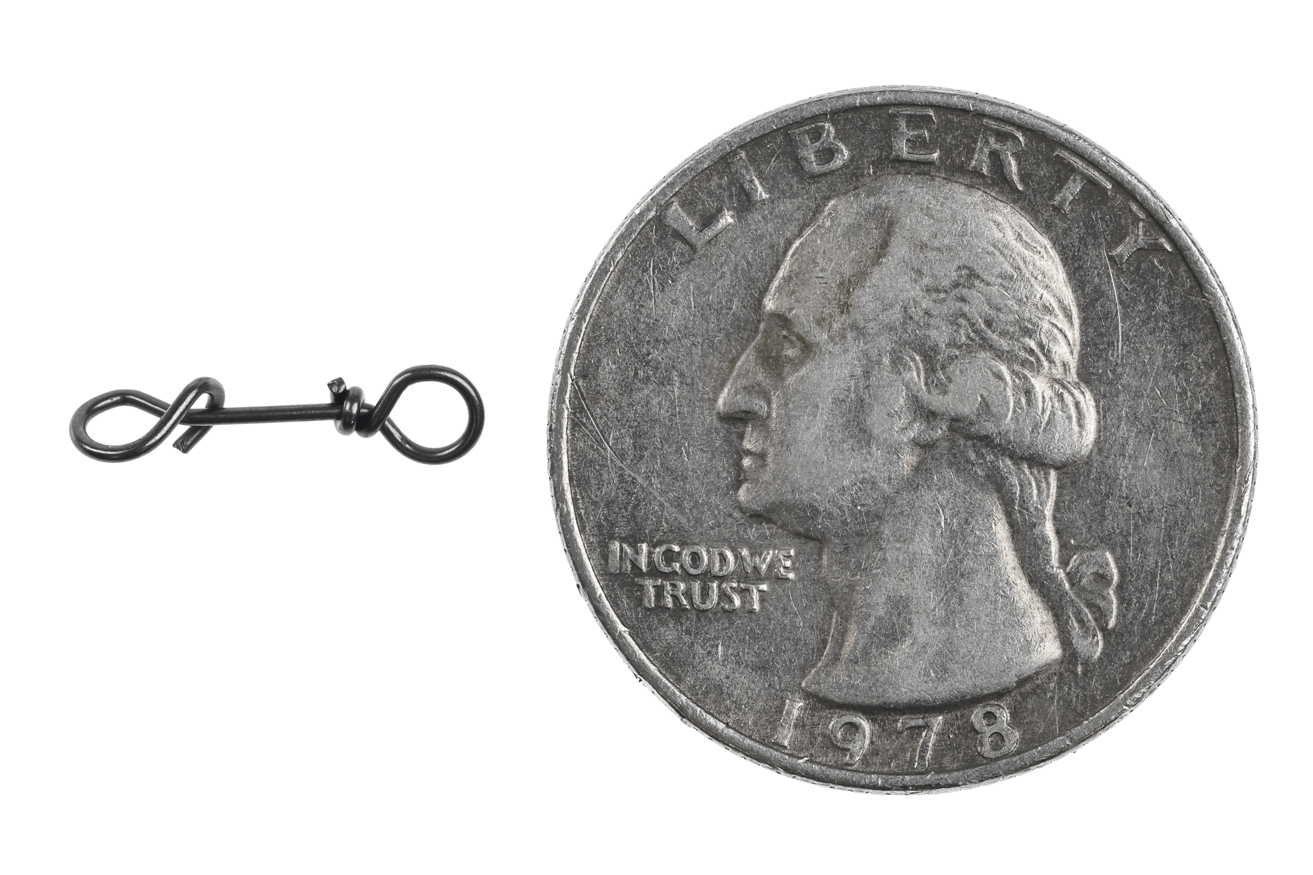 Black nickel Ahrex Fastach clip, small twisted metal connector with loop beside US quarter, fly tying
