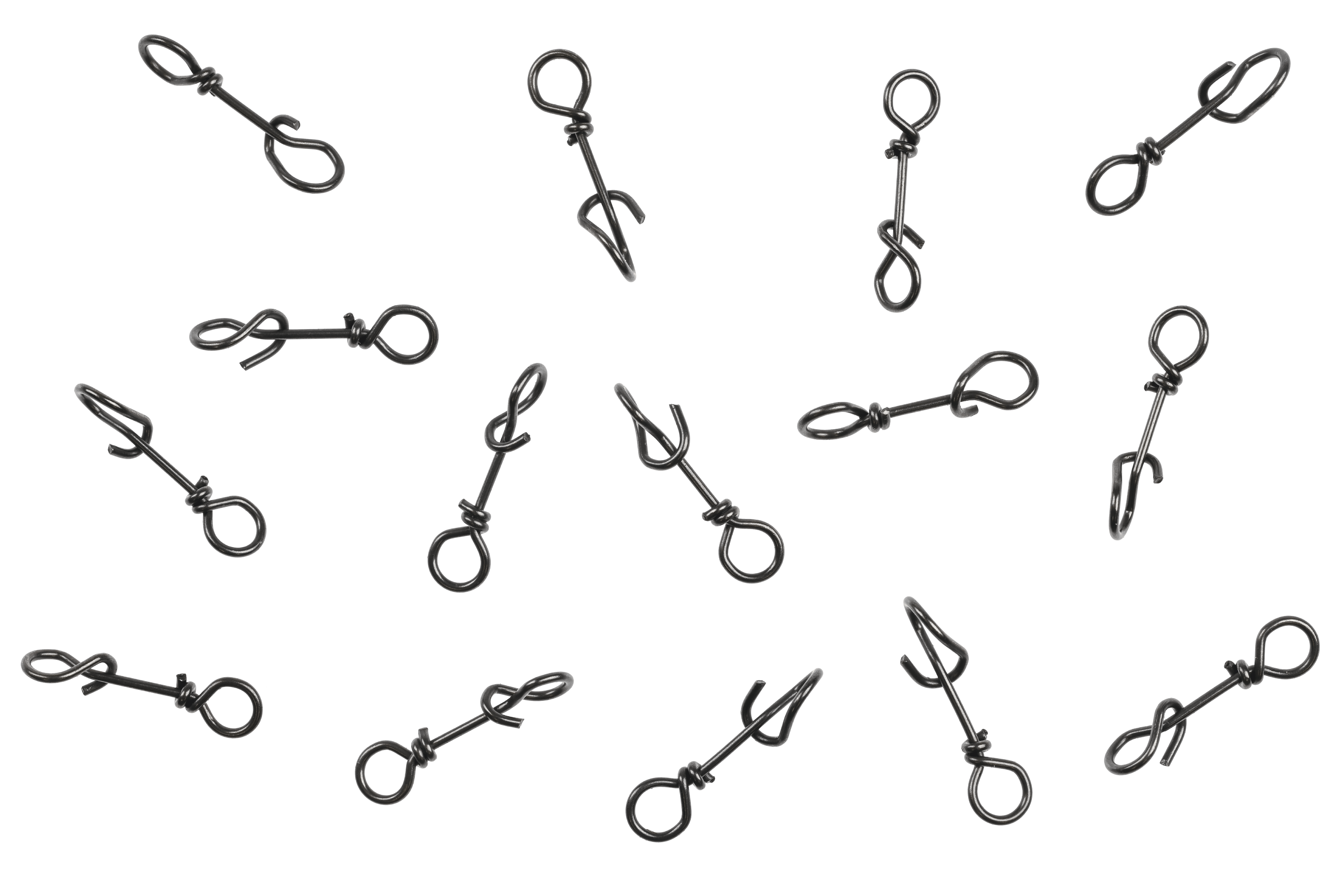 Scattered black nickel Ahrex Fastach wire clips for fly tying, small looped spring-style metal connectors on white background