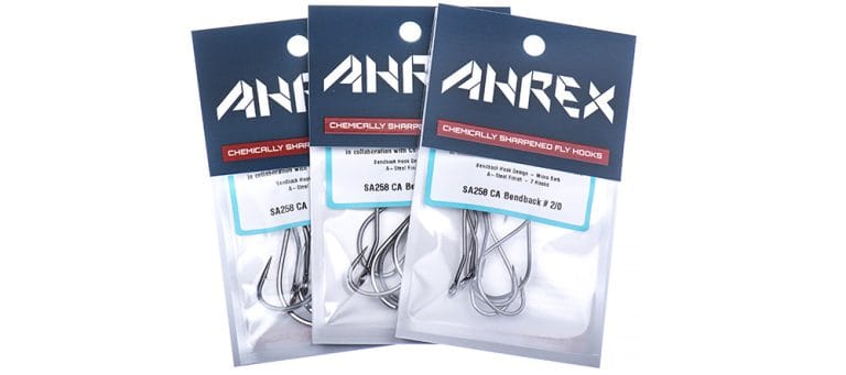 Three packets of silver stainless-steel Ahrex SA258 CA bendback fly-tying hooks in clear plastic pouches with navy AHREX