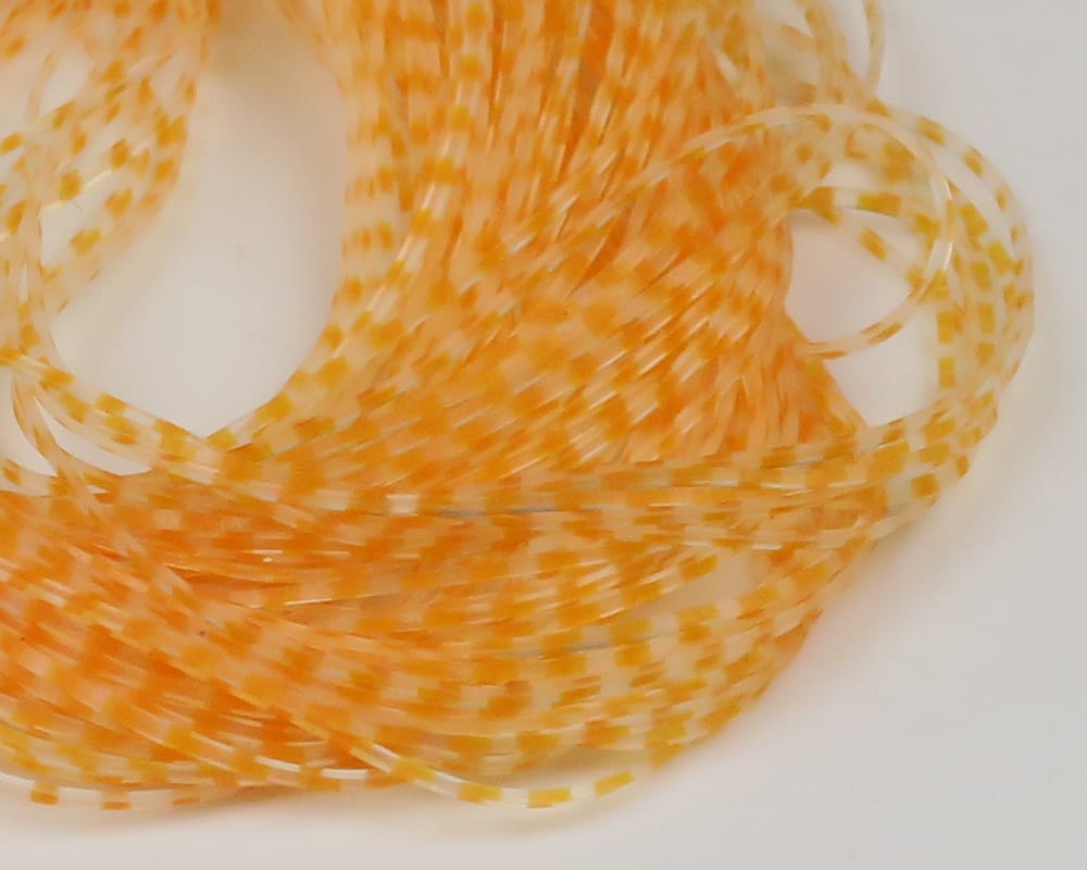 Orange and clear barred synthetic crusher legs, translucent rubbery strands with yellow-orange segments for fly tying