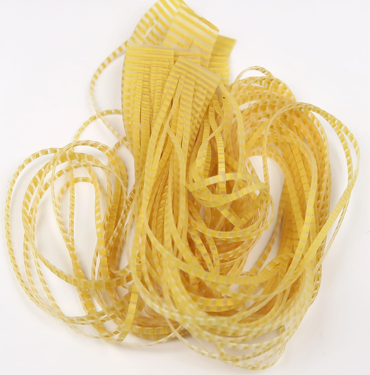 Yellow barred crusher legs for fly tying, thin translucent rubber strips with fine checker-striped pattern