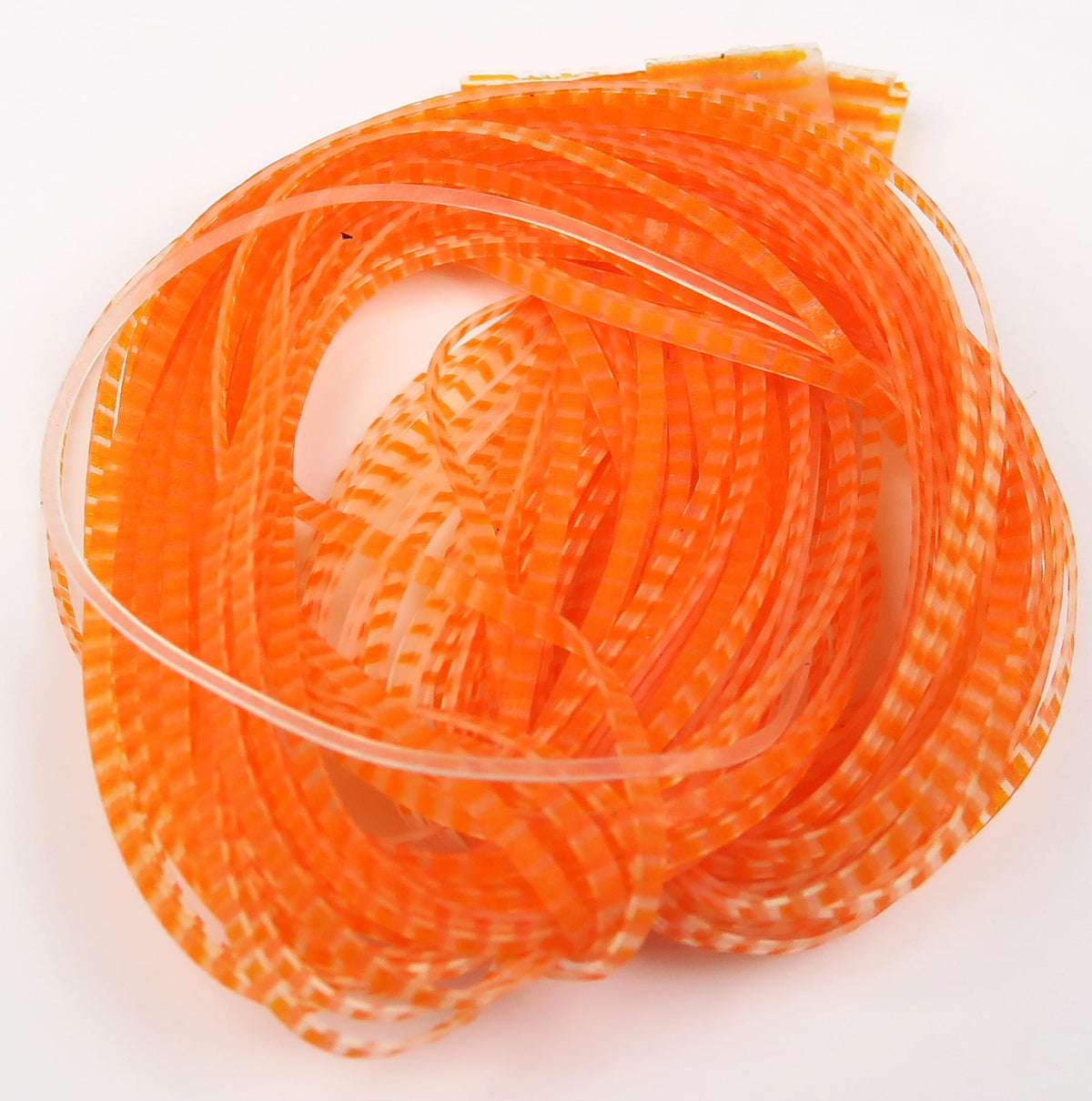 Orange barred synthetic crusher legs for fly tying, narrow translucent strips with white checker pattern