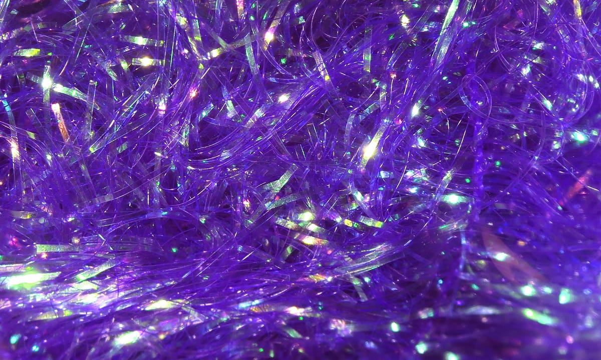 Purple iridescent synthetic filler flash strands with holographic shimmer, fly tying material