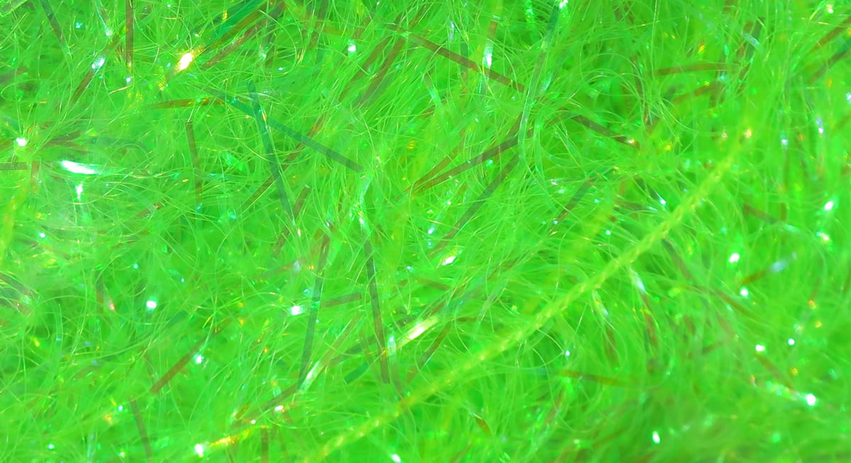 Chartreuse synthetic fly-tying fibers with iridescent flash and thin holographic tinsel strands