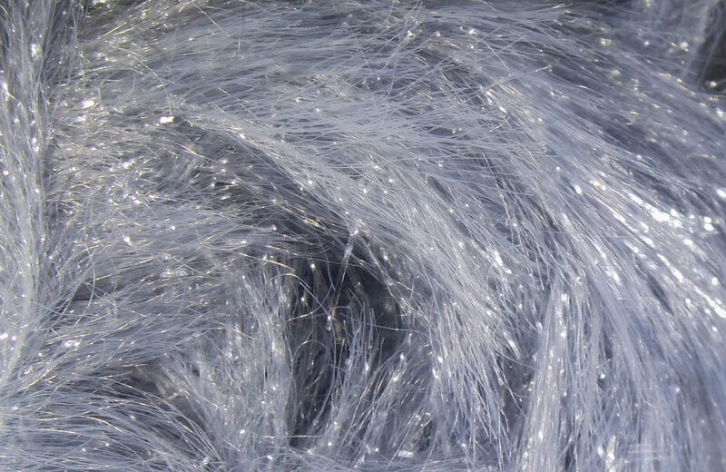 Silvery gray synthetic chenille fibers with fine sparkling tinsel strands, Chocklett's Finesse body chenille for fly tying