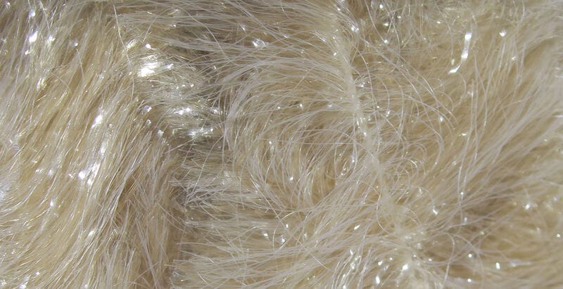 Cream pale tan chenille with silky fibers and subtle iridescent flash for fly tying