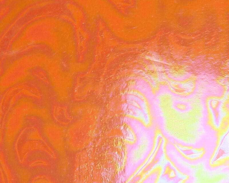Iridescent orange Chocklett's Loco Foam sheet with pink and yellow metallic swirl marbling, glossy fly-tying foam