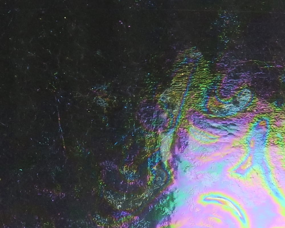 Hareline Chocklett's Loco Foam iridescent black foam sheet with rainbow holographic swirls, textured fly tying foam