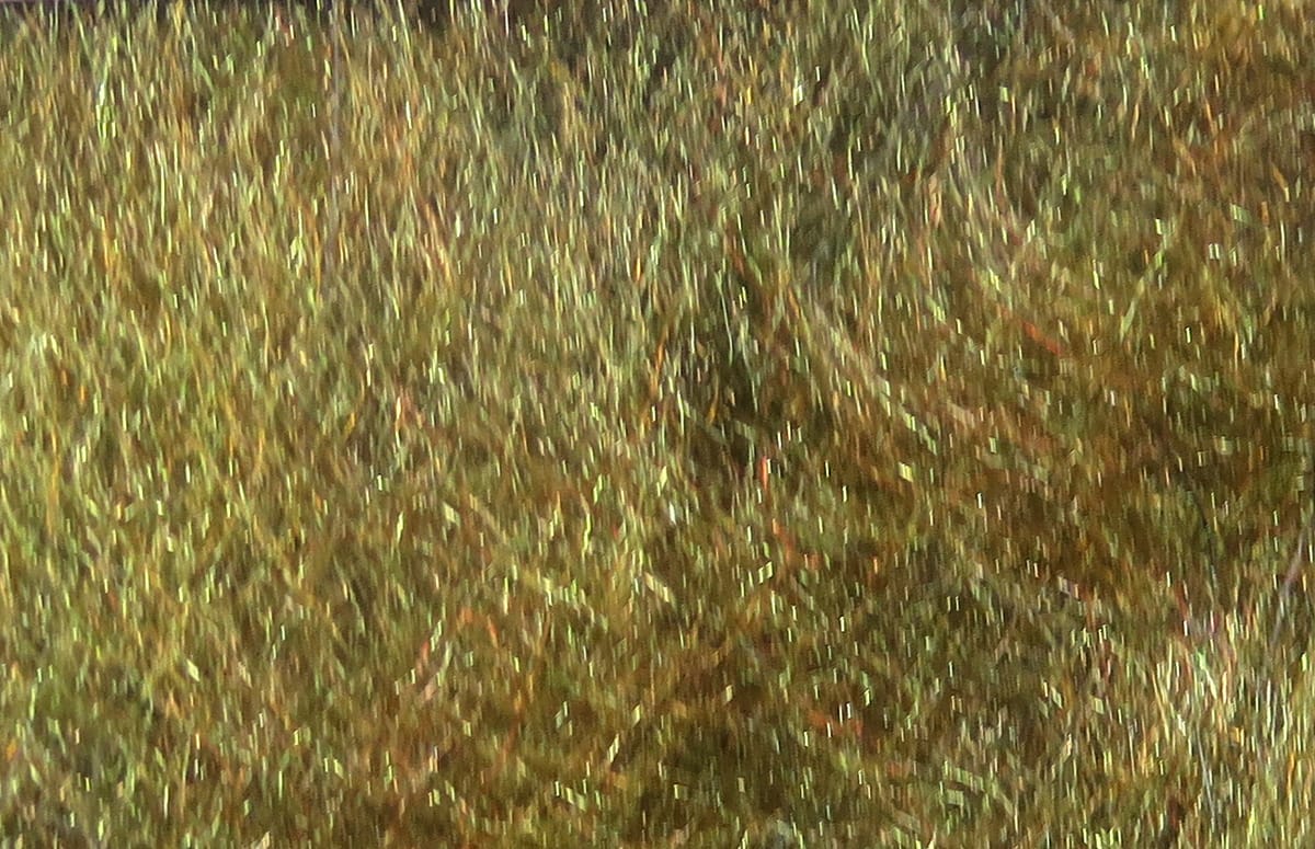Olive-brown synthetic dubbing with gold and green iridescent flash, fine hairy fibers for fly tying