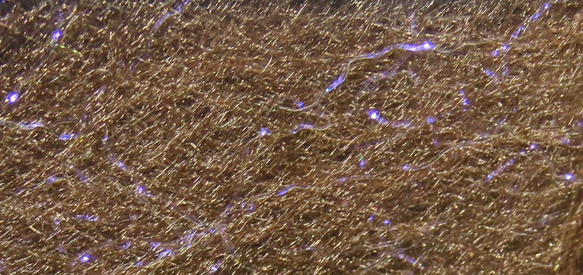 Brown synthetic fly-tying dubbing with fine fur-like fibers and purple-blue flash strands, Hareline Jr. Bruiser Blend