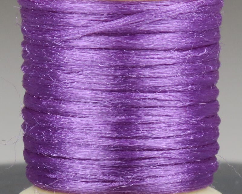 Purple Hareline Antron yarn spool, shiny synthetic fly-tying fiber with silky sheen and fine fuzzy texture