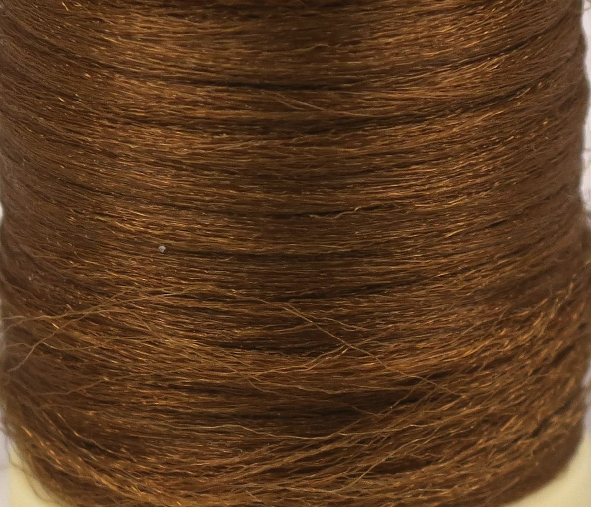 Copper brown Hareline Antron yarn spool with fine shiny synthetic fibers for fly tying