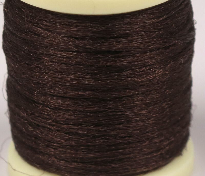 Dark brown Hareline Antron yarn spool with fine shiny synthetic fibers for fly tying