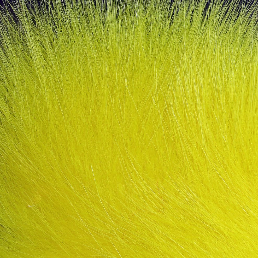 Fluorescent yellow Arctic fox hair, long soft fibers and dense fur for fly tying