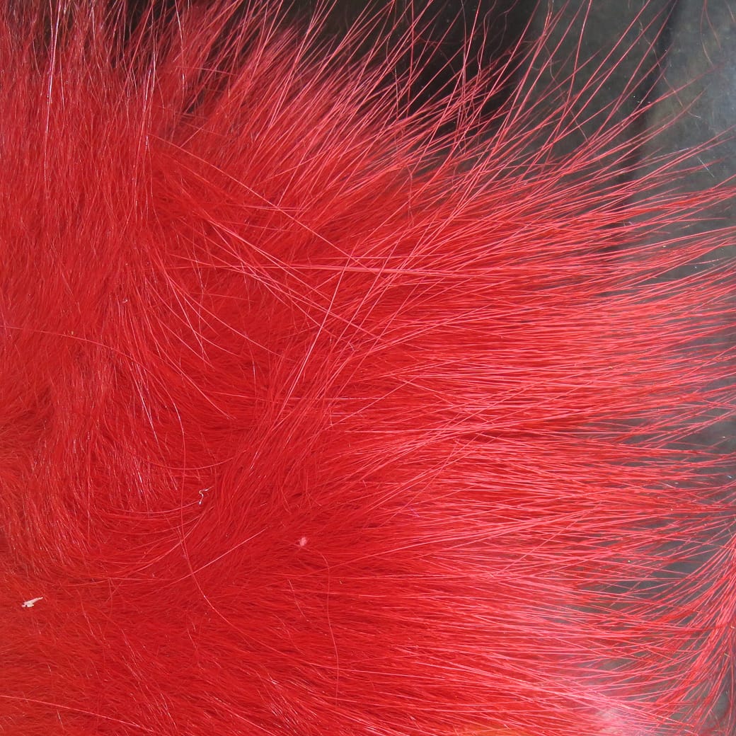 Bright red Arctic fox hair with long silky guard hairs and soft dense underfur for fly tying