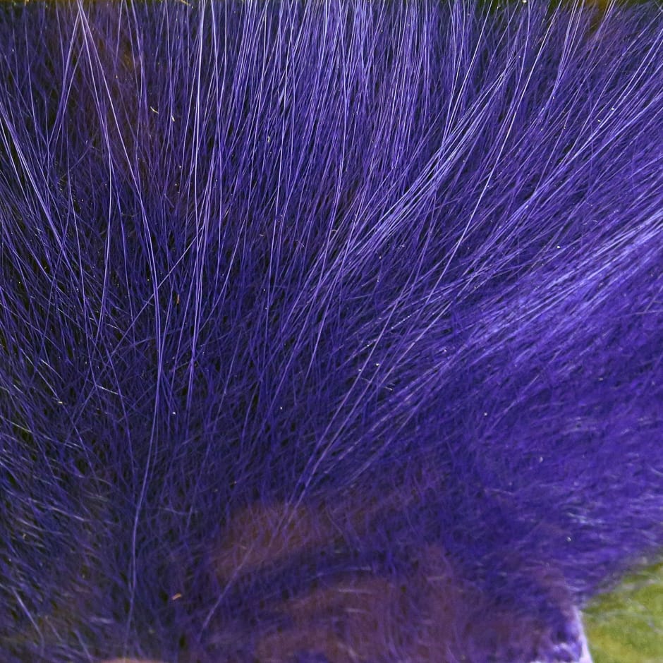 Vibrant purple Arctic Fox hair tuft with long fine guard hairs and soft underfur for fly tying