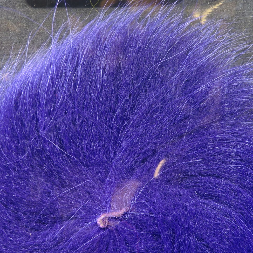 Vibrant purple Hareline Arctic fox tail hair, long soft fur fibers with fluffy tapered style for fly tying