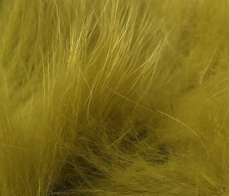 Olive-yellow Arctic fox zonker strips with long guard hairs and soft fluffy underfur for fly tying