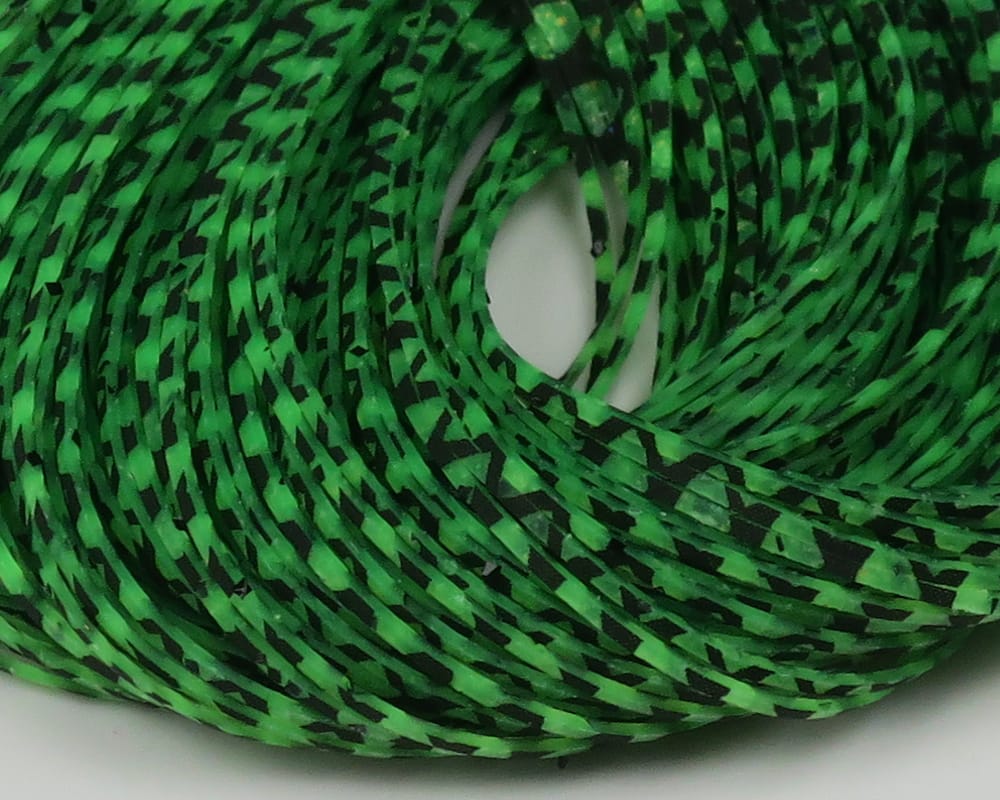 Coiled Hareline Barred Crazy Legs fly tying material: bright green rubber strips with black barred pattern