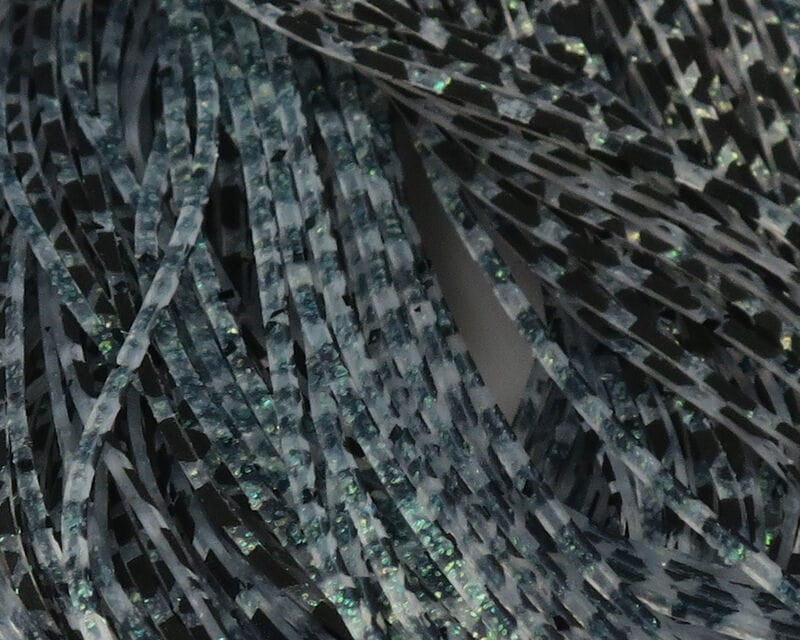 Barred gray-black rubber legs with green iridescent flakes, long thin strands for fly tying