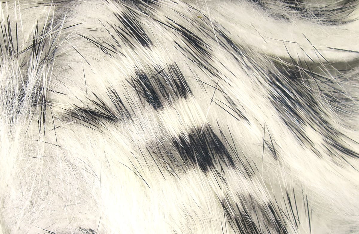 White rabbit fur strips with black barred markings, soft long hairs for fly tying