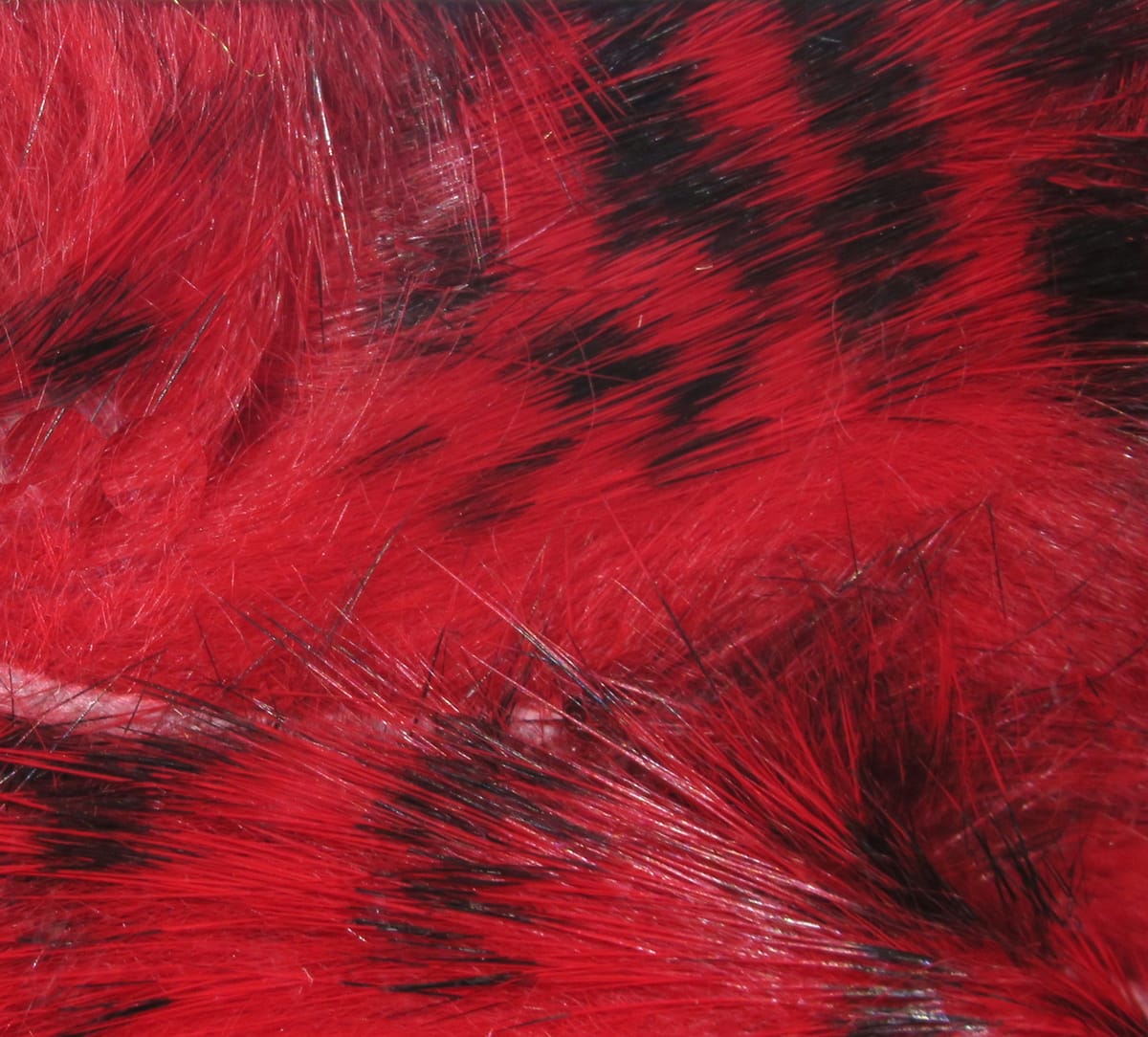 Bright red rabbit fur strips with black-barred markings, glossy long-hair texture for fly tying and craft lures