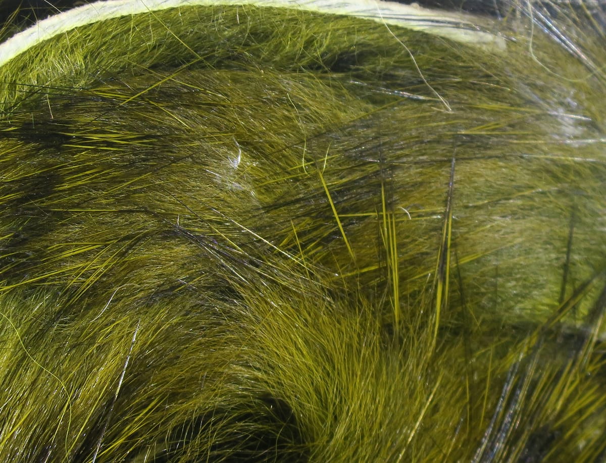 Olive green black-barred rabbit fur strips with long guard hairs for fly tying