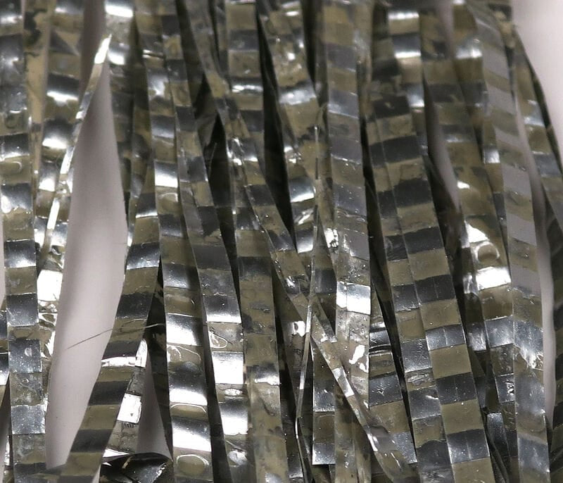 Hareline Barred Matrix fly fiber: glossy silver flat strands with dark barred pattern for fly tying