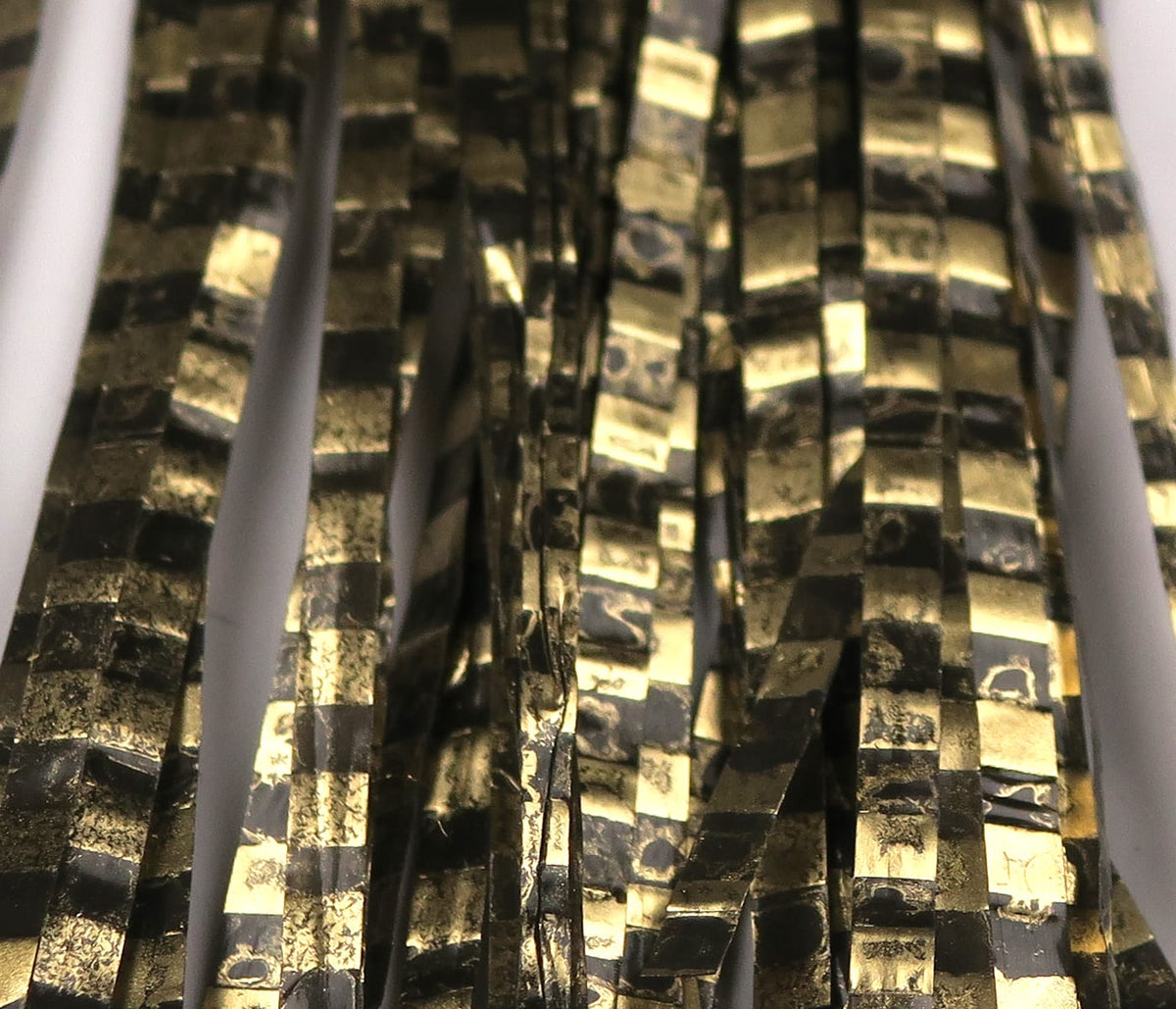 Hareline Boothe's Barred Matrix fly fiber - black and metallic gold checkered synthetic strips for fly tying