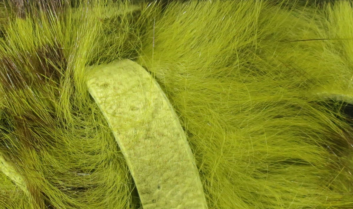 Dyed chartreuse rabbit fur strip with brown barring, long soft fibers and leather backing, fly tying material