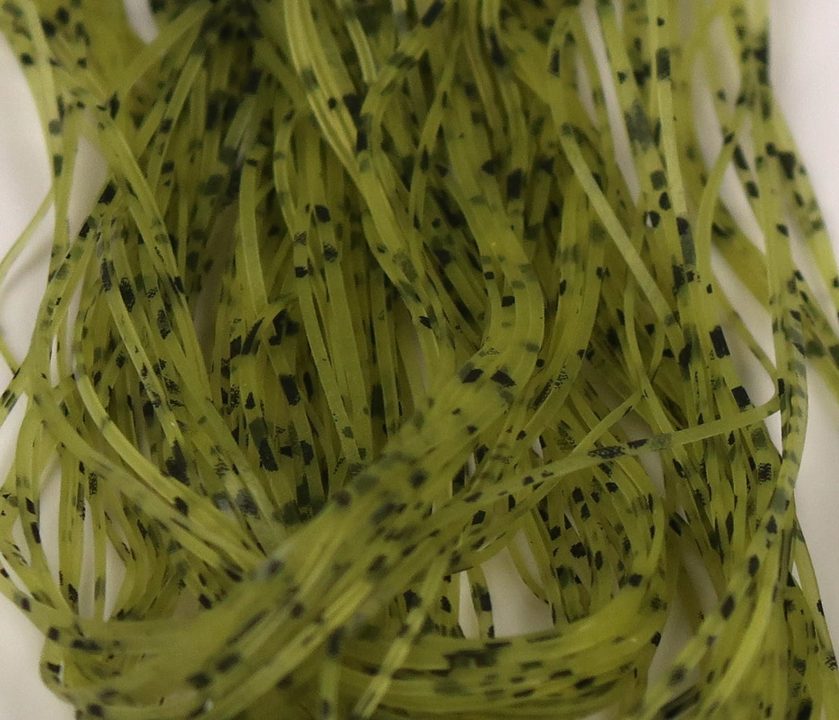Olive green Hareline Buggy nymph legs - thin flat synthetic rubber strands with black speckles for fly tying