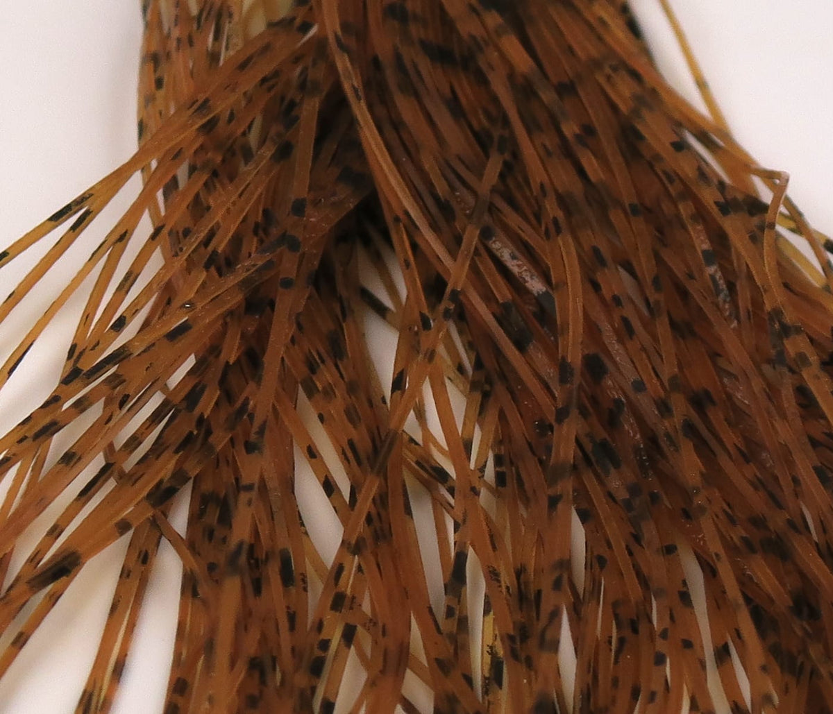 Brown spotted synthetic buggy nymph legs, narrow rubbery strands for fly tying