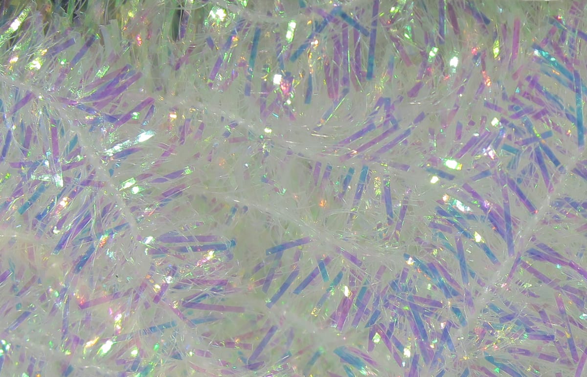 White iridescent cactus chenille with purple-blue holographic tinsel strands for fly tying