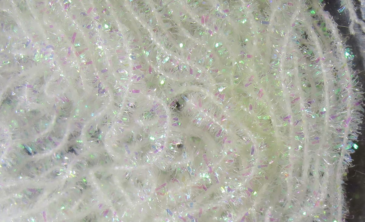 White cactus chenille with iridescent pink and green tinsel fibers, fluffy fly tying material