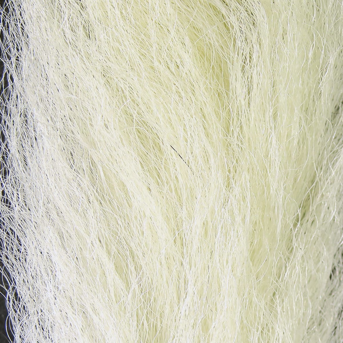 Pale cream Hareline calf tails bundle with long coarse natural hair fibers for fly tying, wispy textured strands