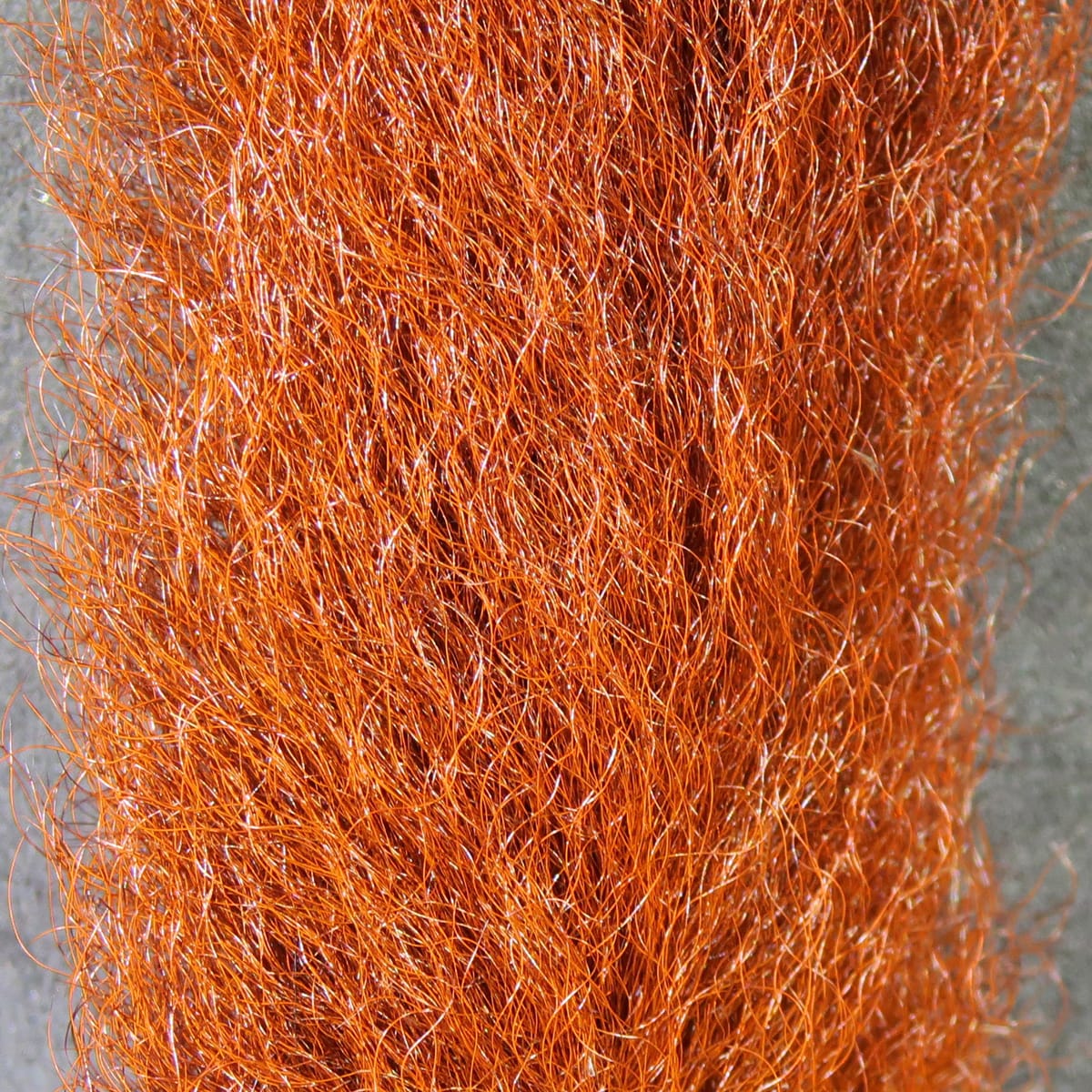 Hareline calf tails, bright copper-orange dense bundle of long fine fur with subtle sheen for fly tying