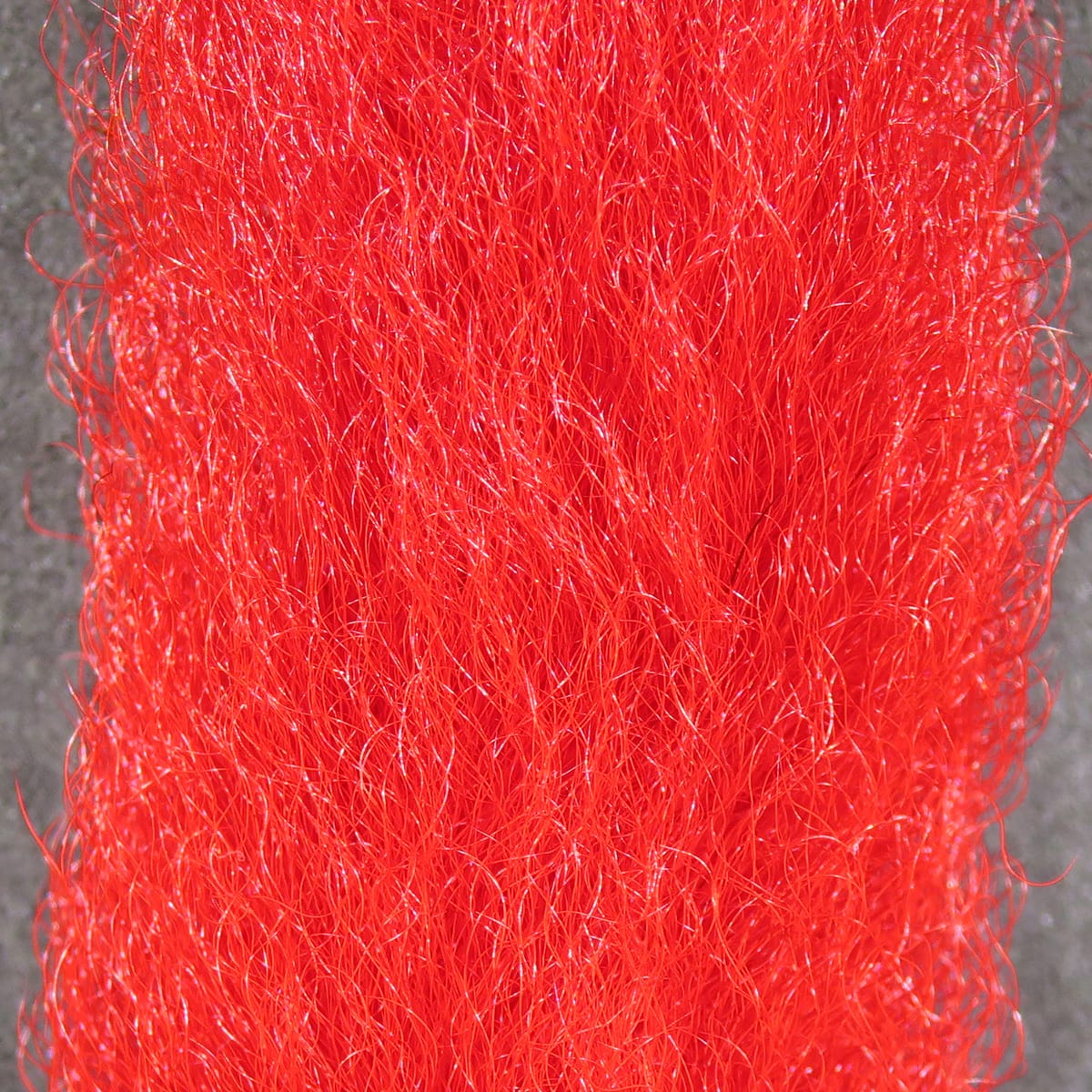 Hareline calf tails bright red synthetic hair with fine glossy fibers, ideal for fly tying